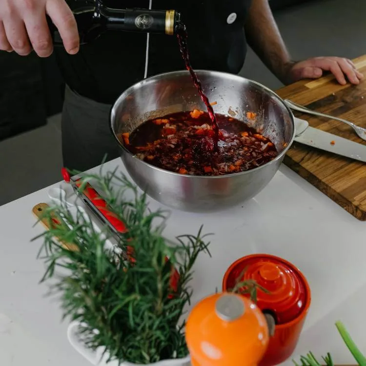 Wild stock with red wine and aromatic herbs