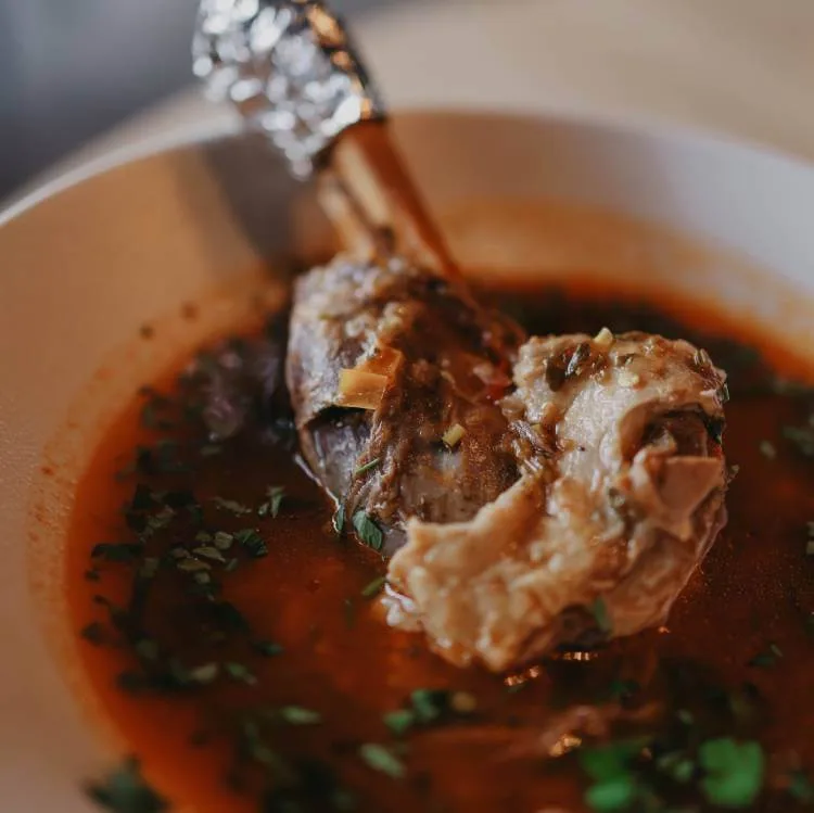 Slow-cooked pork shoulder with organic herb mix